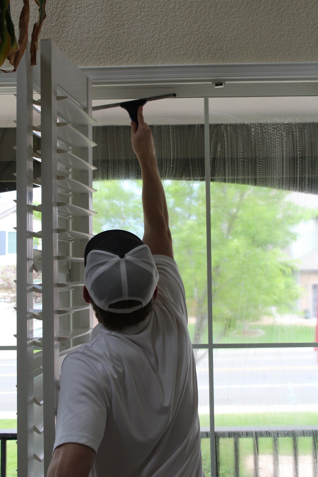 Interior window cleaning with squeegee
